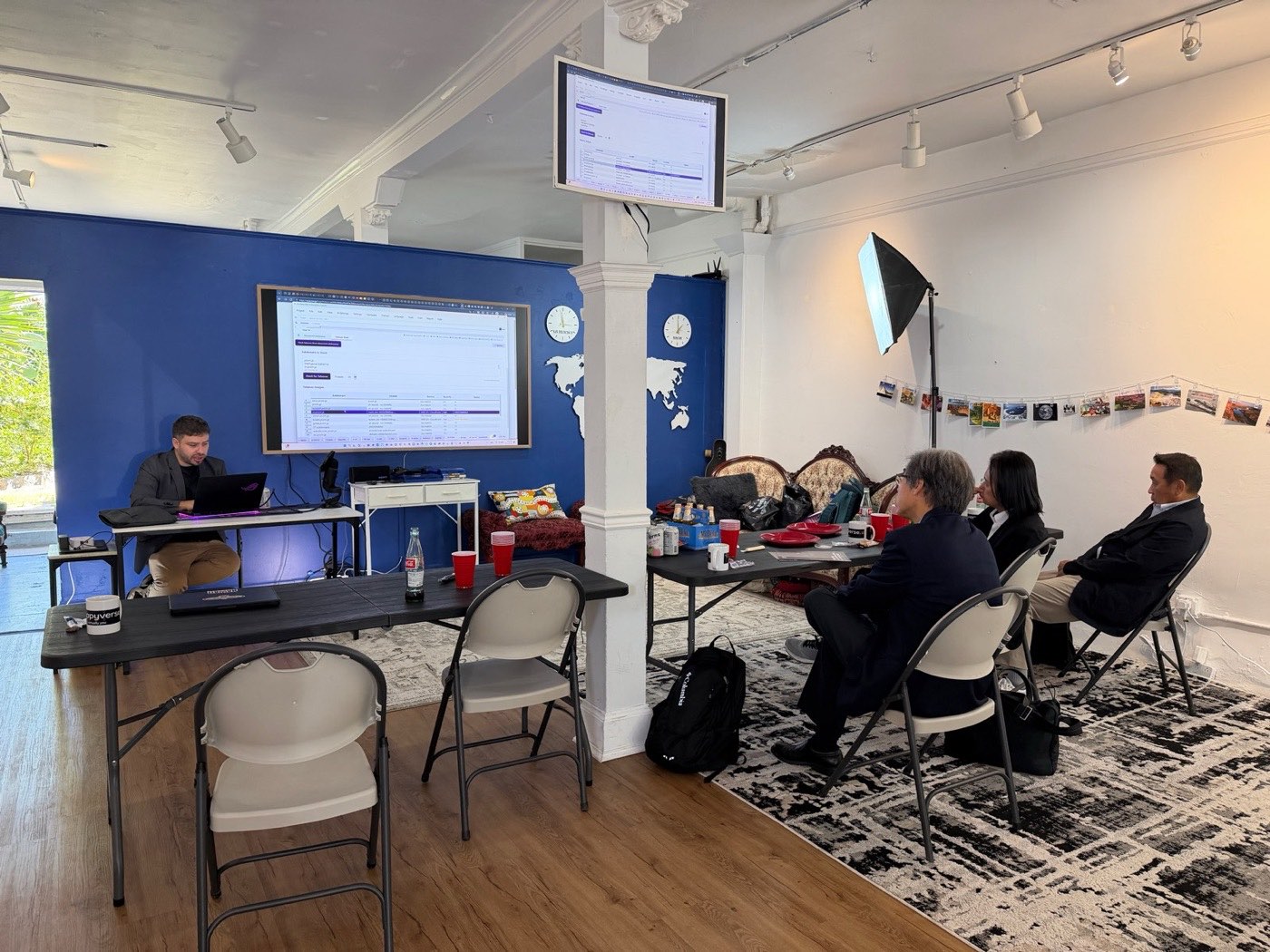 A student presenting a build on the big screen at Demo Day